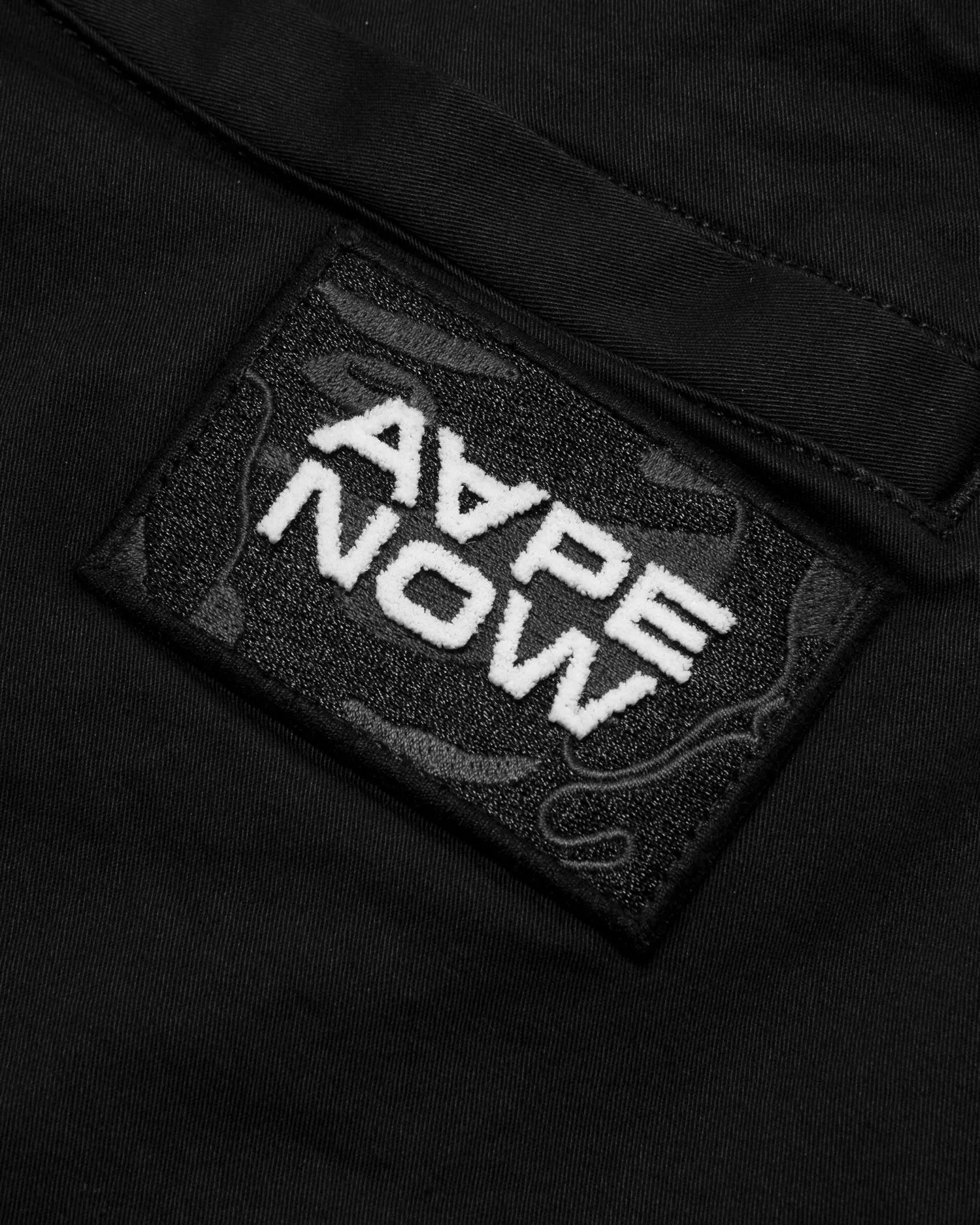 AAPENOW moonface logo tapered jogger pants