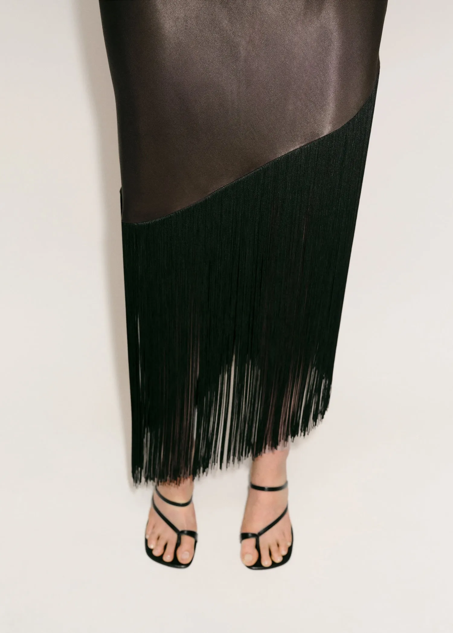 Asymmetrical satin dress with fringes